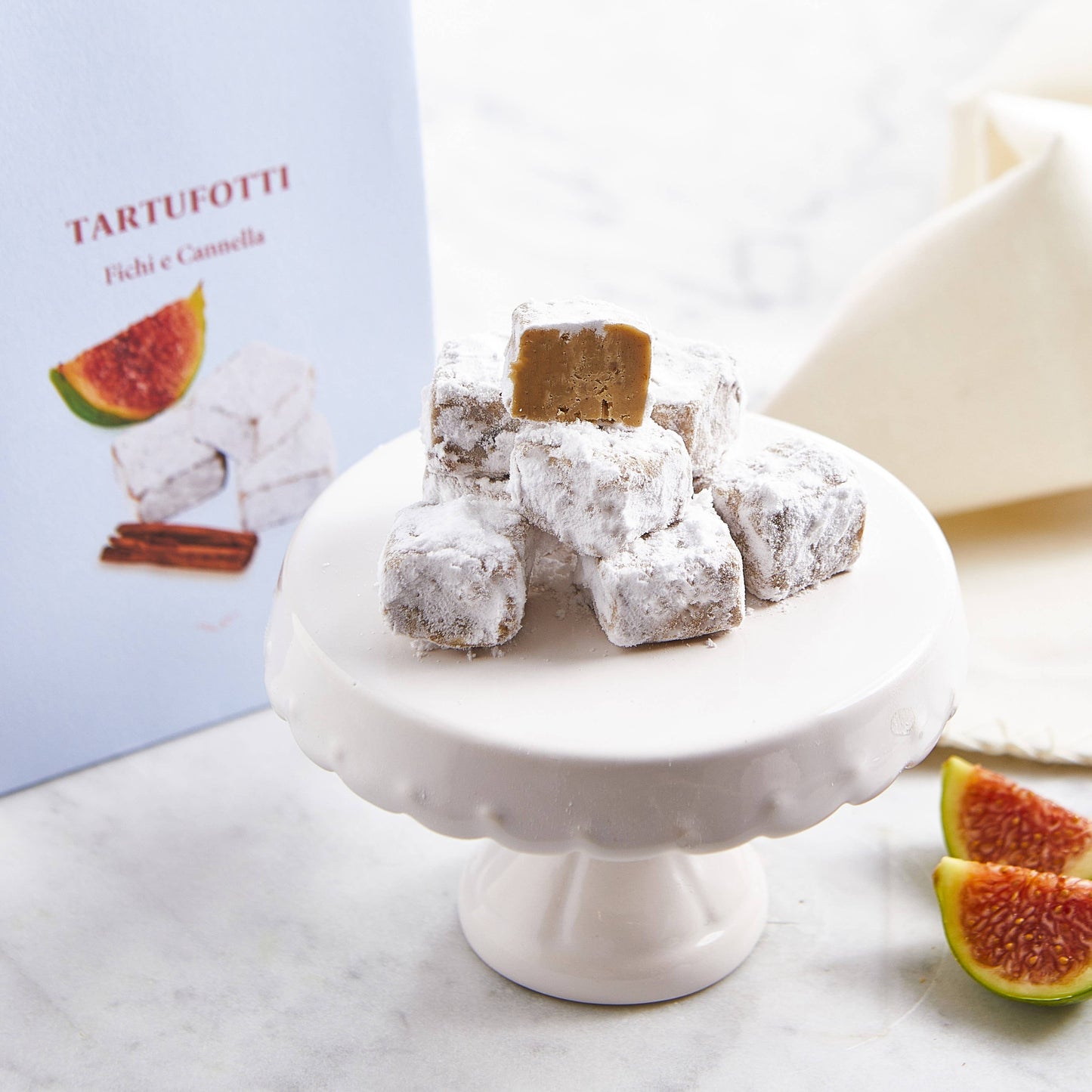 Truffles sprinkled with icing sugar, figs and cinnamon 200g